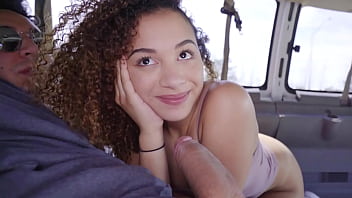 A charming African-American teenager gives a blowjob to a well-endowed man before engaging in rough intercourse in a van